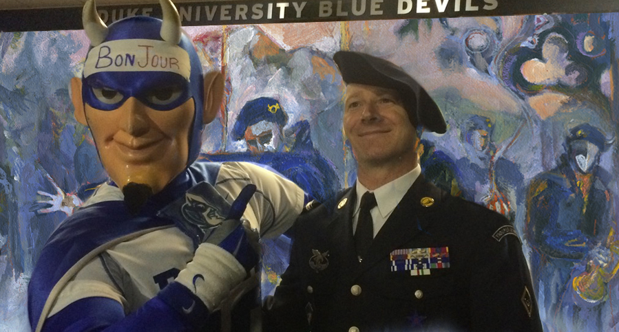 Current Blue Devil Mascot meets senior enlisted NCO Major Lakomy of Les Diables Bleus standing in front of the 300 sq ft. Alpine Gothic installation by Revere La Noue.