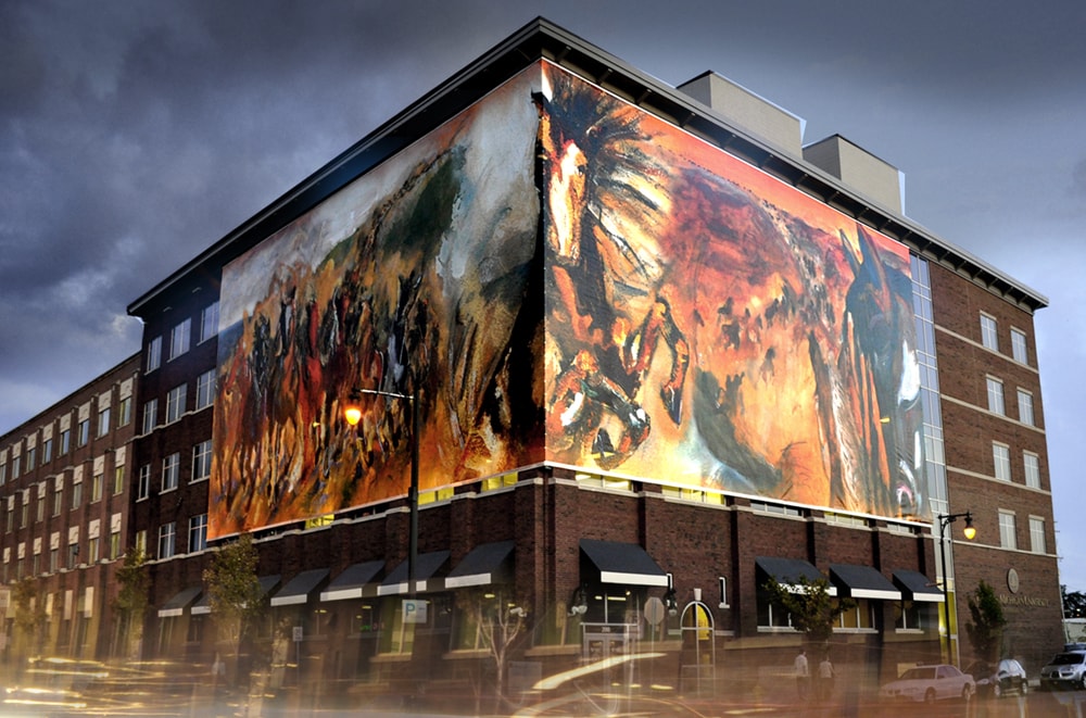  La Noue was commissioned by Western Michigan University to create a four-story, 6500 sq ft. fine art print of stampeding broncos that wrapped around the corner of a city block in Grand Rapids, Michigan; it is the largest publicly displayed fine art 