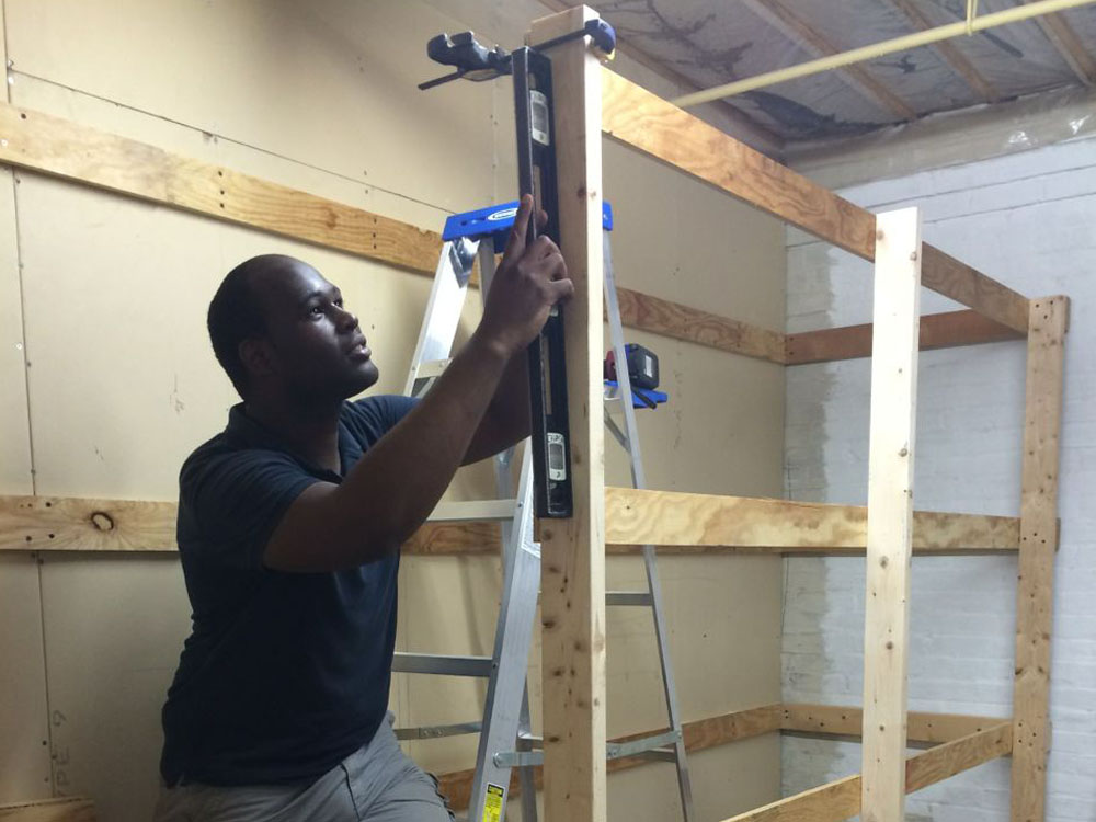Tulio Santos builds a plywood rack based on Roberto's sketches and measurements