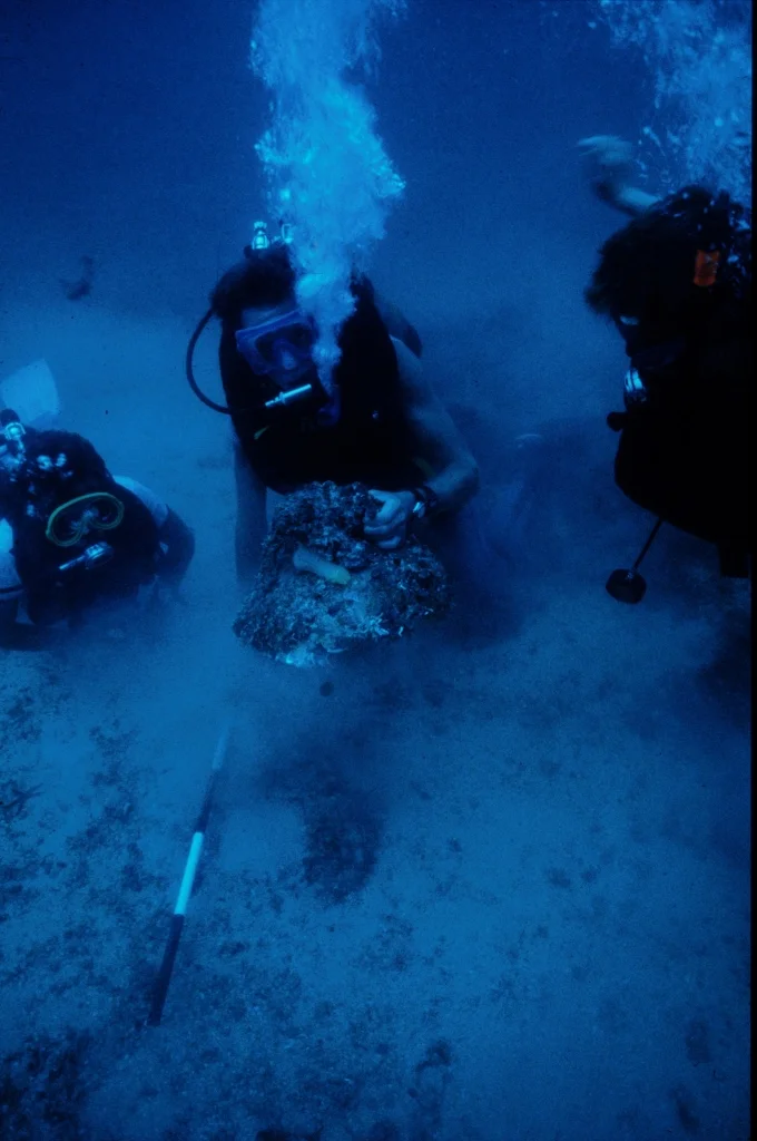 A photo of me with other expedition divers more than 50 metres deep below the Roman wreck at Plemmirio, with a heavily encrusted Byzantine amphora. Divers will spot my beloved Poseidon regulator - bought with the proceeds of a summer working on a farm when I was 16, and still used by me today (you can see it in the ice-dive and night-dive videos on the website homepage).