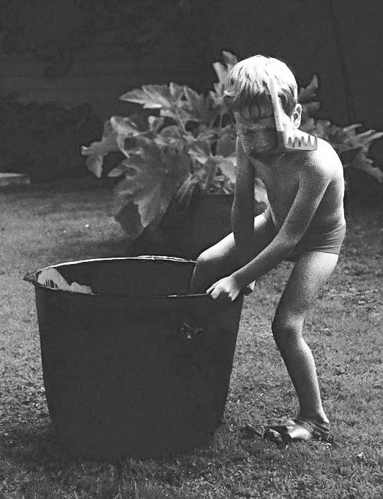 I couldn't wait to dive - a photo of me in New Zealand in the summer of 1966 aged three with cellophane mask, toy garden rake snorkel and rubber glove fins.
