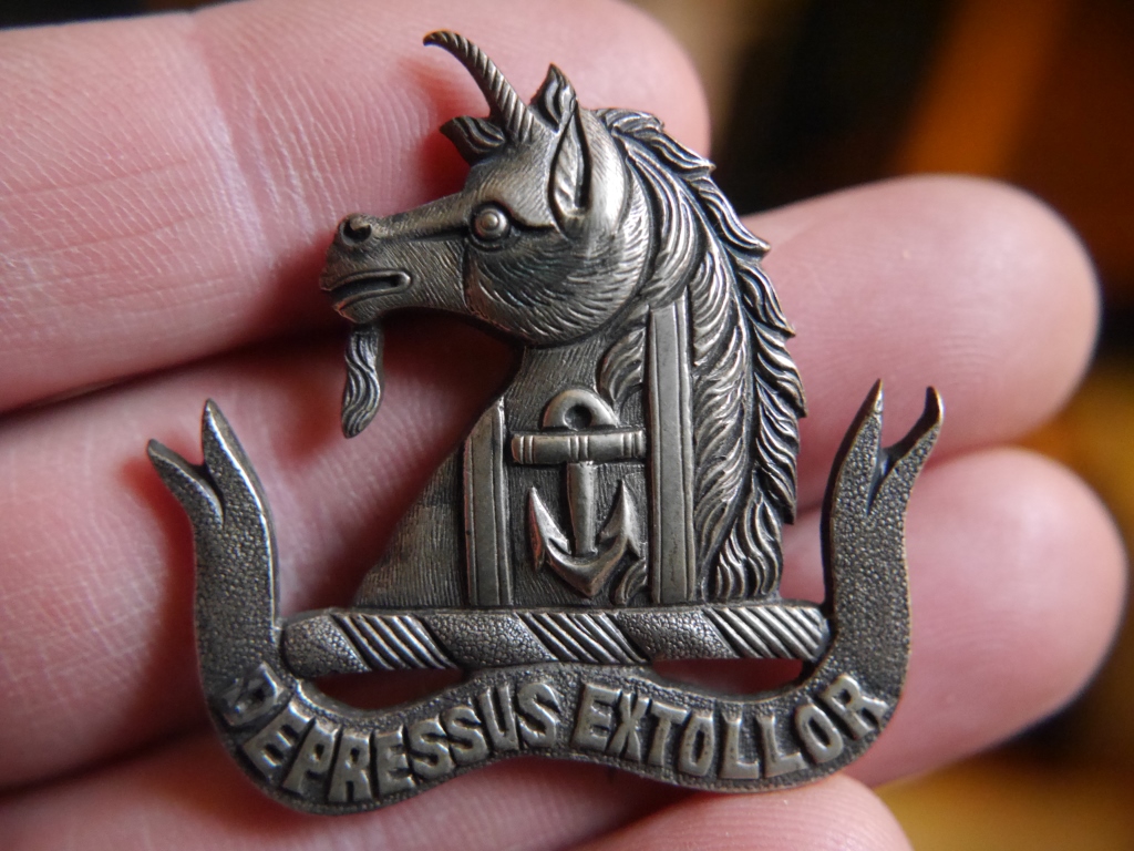 This Victorian brooch from my great-grandmother shows the unicorn and anchor of the Gale coat of arms, and the motto Depressus Extollor ('Having been depressed, I am exalted').