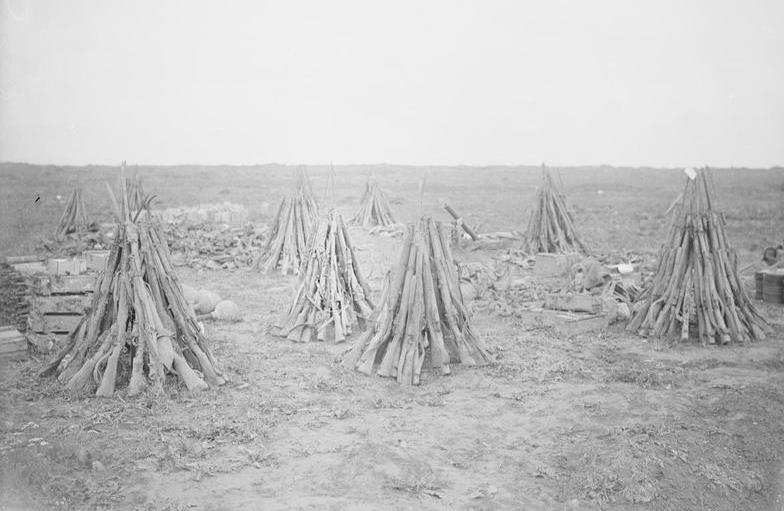 'Salvage collected after the advance', Morval, September 1916. These British Lee-Enfield rifles taken from dead and wounded men would have been among the material 'forwarded to the various dumps' noted in the letter above (photo: Lt John Warwick Brooke, IWM Q 4317 ).