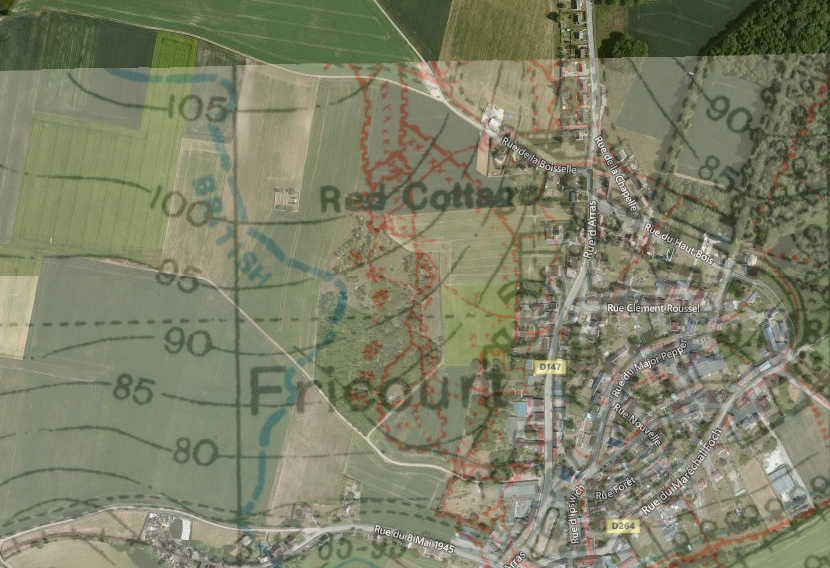 An overlay of the 25 April 1916 British 1:20,000 trench map 62D.NE2 on a satellite image of Fricourt and the fields to the west. In the centre is no-man's land as it existed before 1 July 1916, with the British front line in blue to the left and the German in red to the right. The red blotches where the lines are closest, between the words Red Cottage and Fricourt, are the 'Tamour mines', the craters of which are still visible in the woodland that covers that part of no-man's land today. Fricourt New Cemetery is in no-man's land to the left of the letter R in Red Cottage; the point where I took the photo holding the artefacts looking back towards the cemetery is at the top left of this image where the lane crosses the continuation of the British front line, not shown here but marked on the adjacent trench map (from the National Library of Scotland First World War trench maps website .)