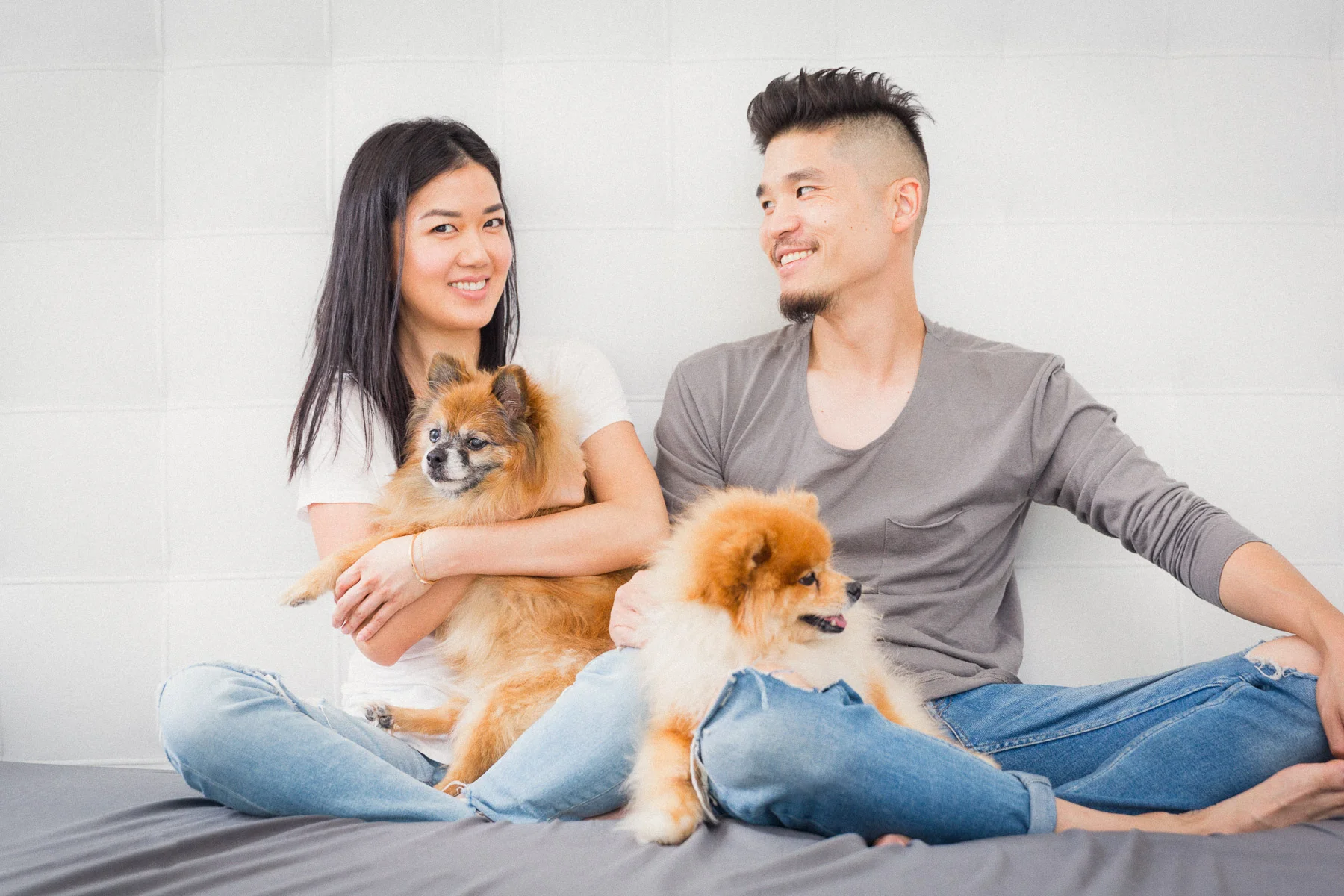 couple-with-dogs-pomerania-happy-in-bed.jpg