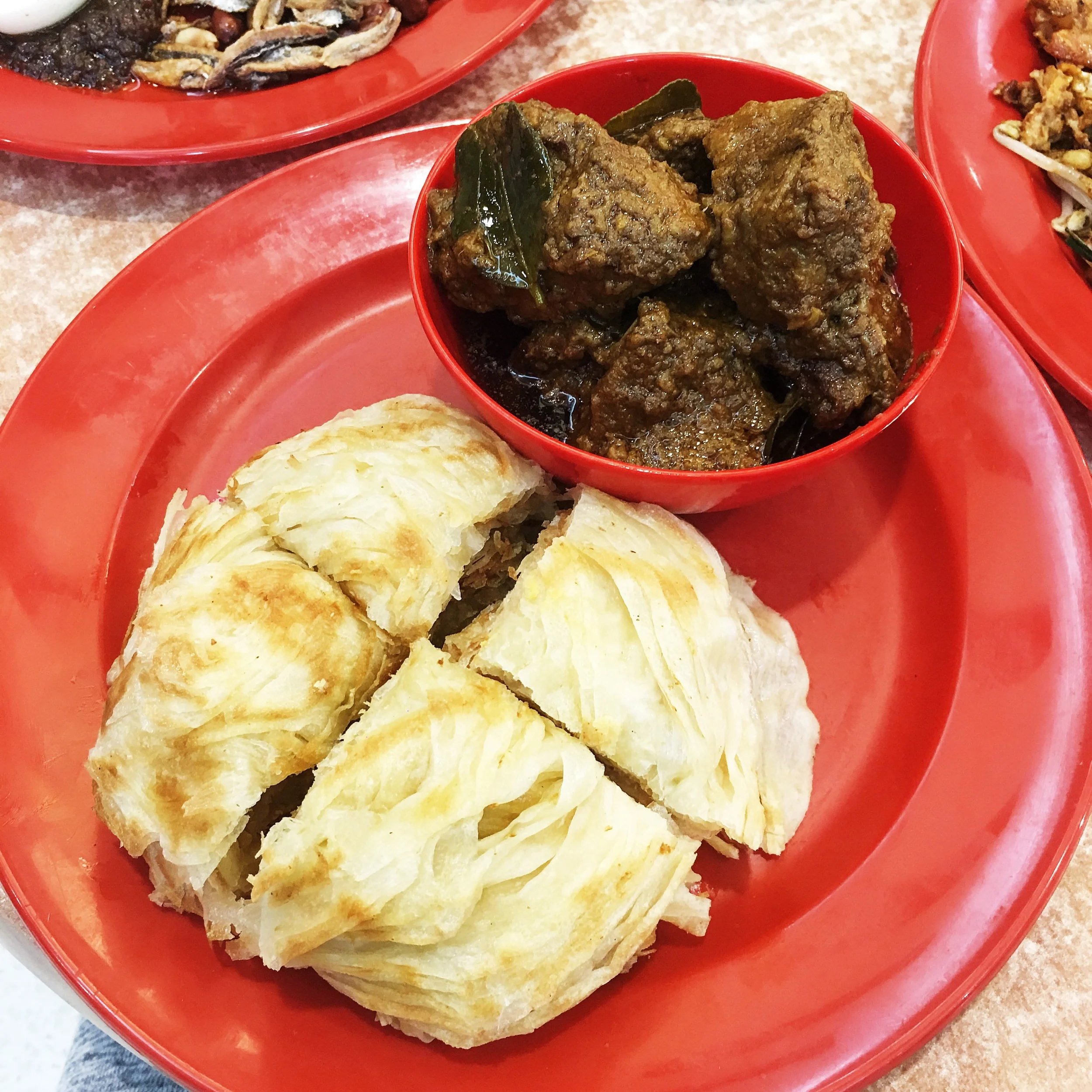 Roti Canai with Curry Beef - The roti dipped in curry and the softened down beef hit the spot!