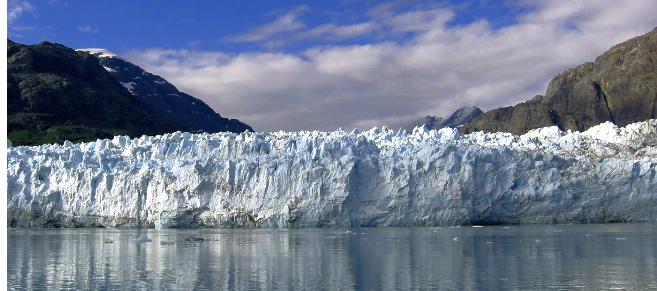 Margerie Glacier is one of the primary glacier viewing destinations in Glacier Bay National Park. This mile wide face of ice is only a tributary to the greater Grand Pacific Glacier, Known to the Huna Tlingit as Sit' Tlein. Oral history is still told of Sit' Tlein advancing "as fast as a dog could run" forcing the Huna Tlingit out of their homeland and on to what is now known as the community of Hoonah. This is among many narratives shared by Cultural Heritage Guides with visitors to Glacier Bay.
