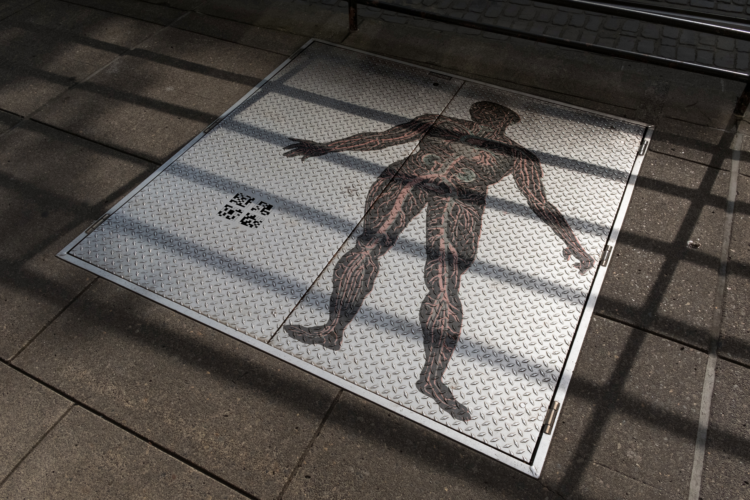 Metal Plate on Sidewalk with Leg copy.jpg