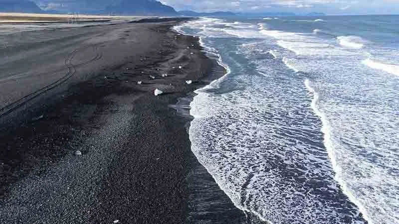 black sand beach drone photography