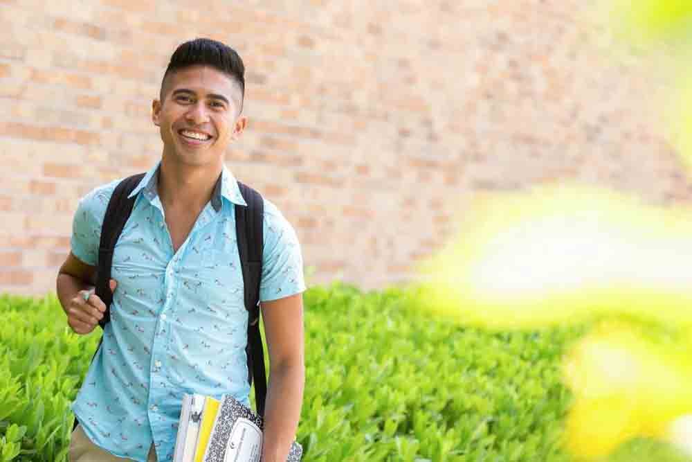 dynamite-studio-inc-photographer-orlando-florida-education-school-university-asian-student-in-front-of-library-40.jpg