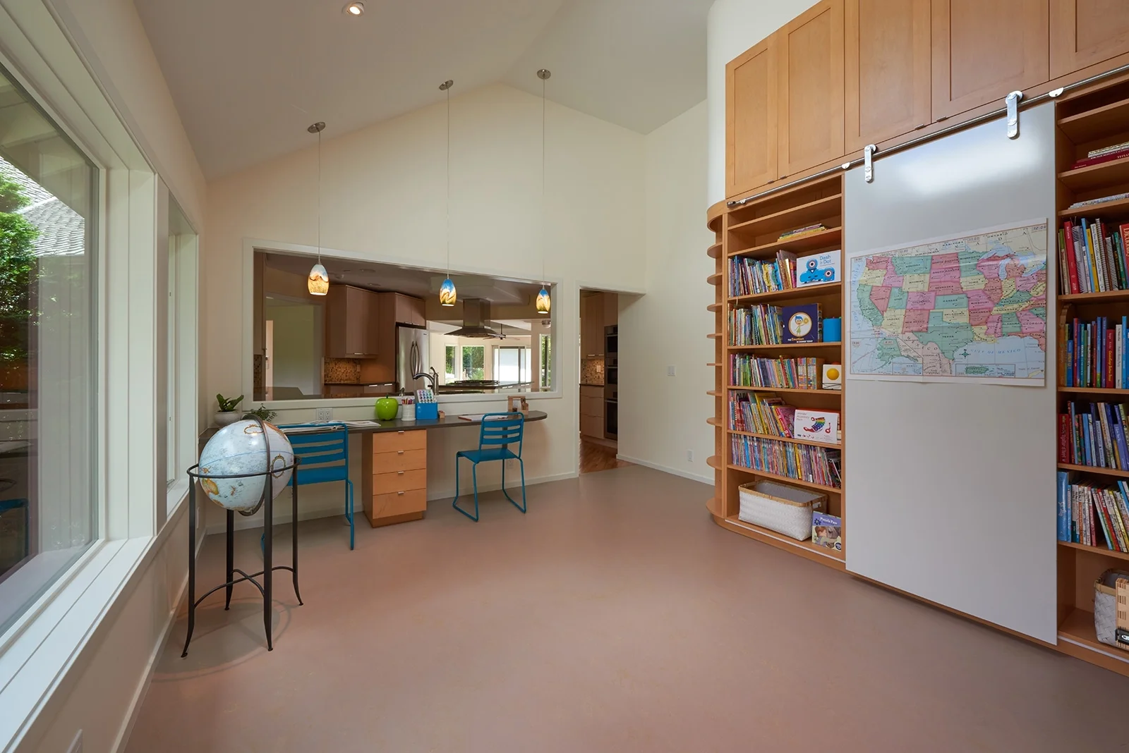 The naturally-lit playroom interiors, designed Lucy Johnson Interior Design, received a National Kitchen and Bath Association Design Award for design excellence.