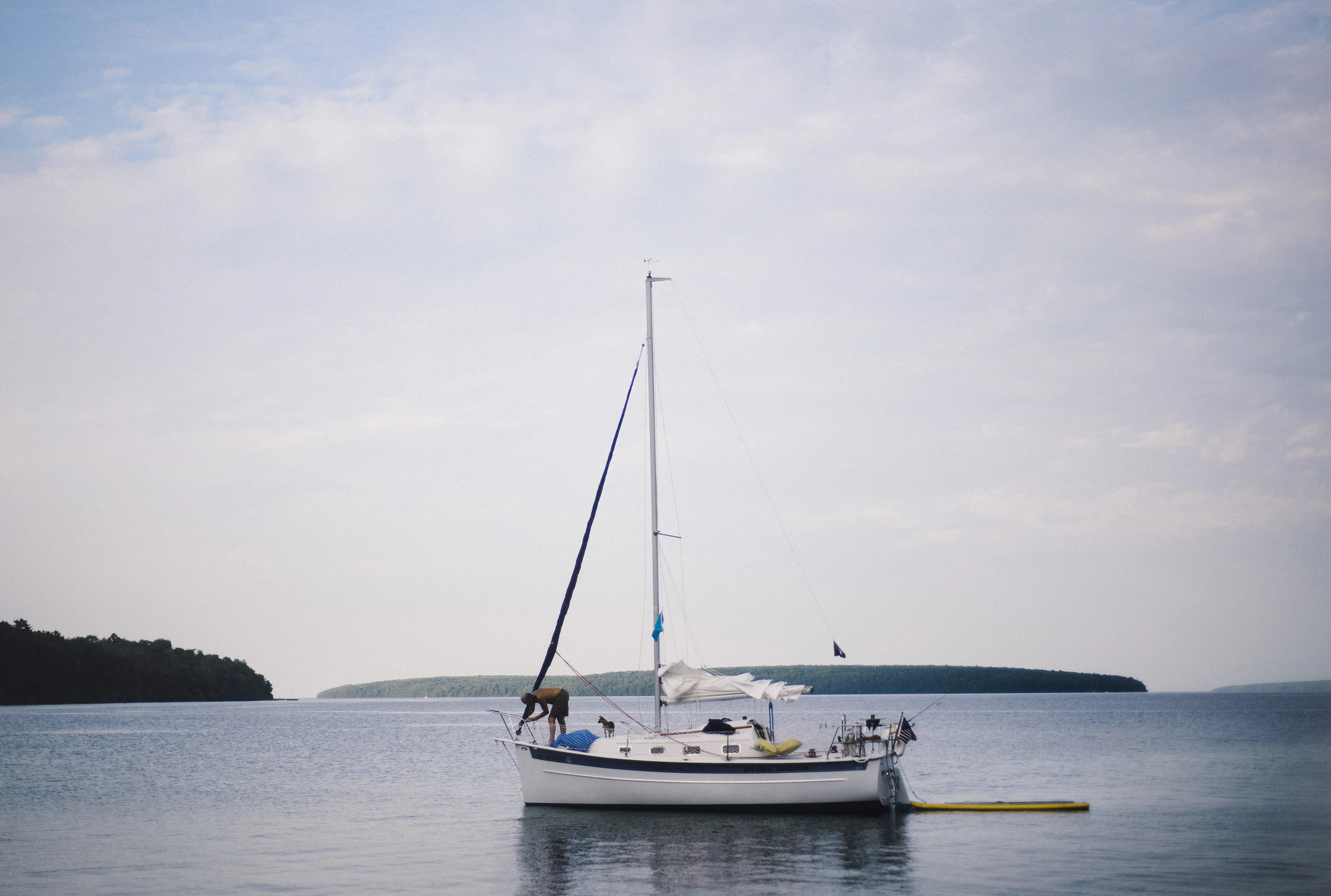 A man and his dog, from the shore of Lake Superior during our trip to Madeline Island.