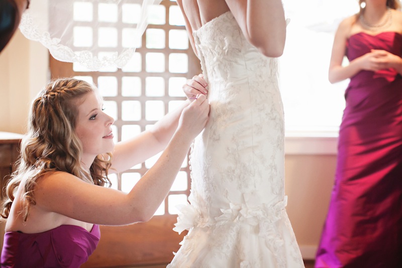 052413-1-slide-bridesmaid-bride-getting-dressed.jpg