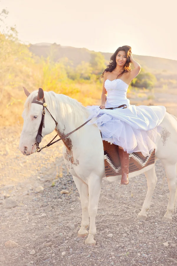A Gorgeous Bride on a white horse | from Arina B Photography