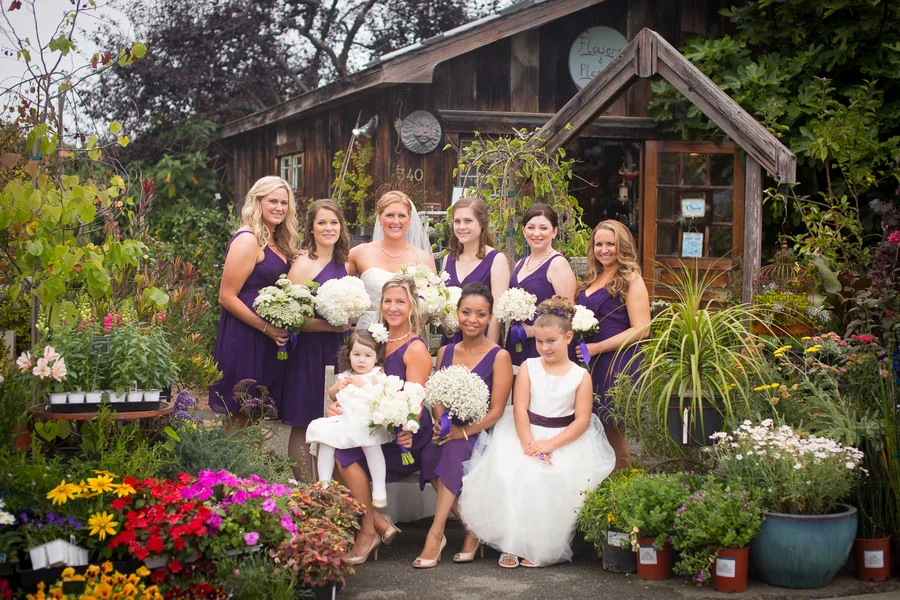 Bride and her Wedding Party, group photos taken in a Flower Shop and Nursery | photo by Portrait Design by Shanti