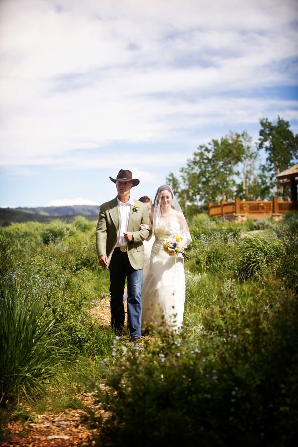  bride and her dad walking down a wildflower aisle in a Utah wedding&nbsp;| photo by&nbsp;Pepper Nix Photography 