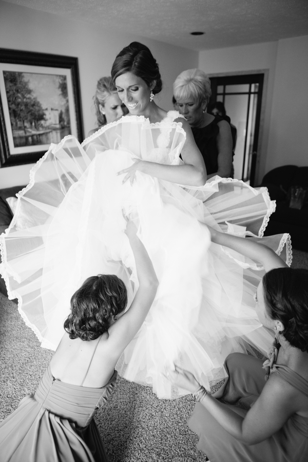 great shot of the bride getting into her wedding gown | photo by Mary Dougherty Photography 
