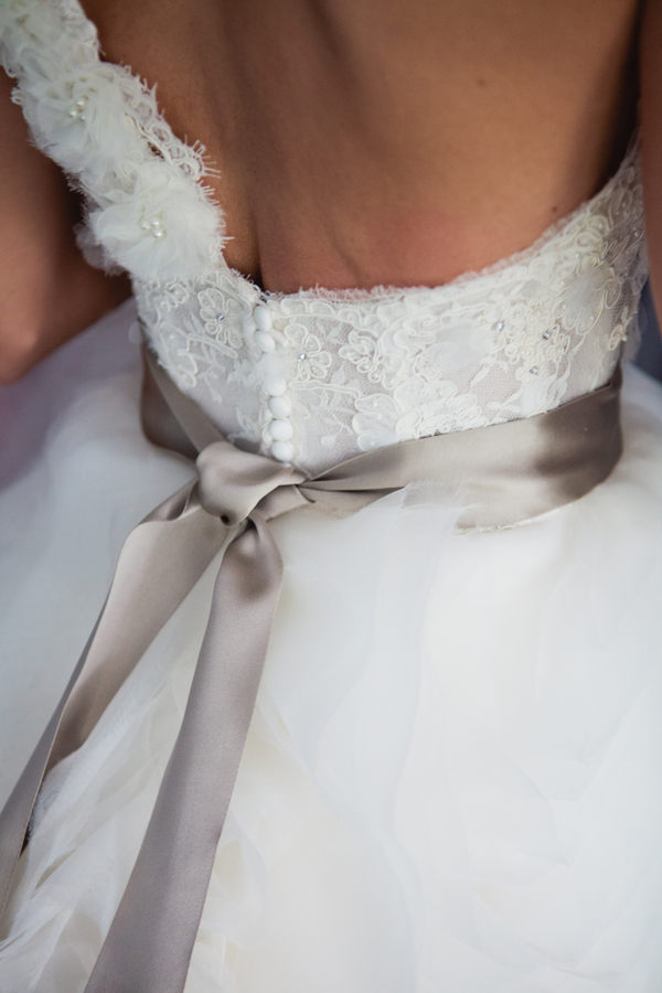  stunning backside of the bride's one shoulder Lazarro wedding gown | photo by Mary Dougherty Photography 