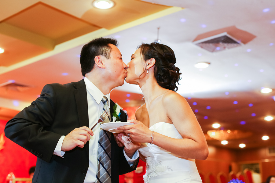  The "after cake cutting" kiss | from a Traditional Chinese Wedding Tea Ceremony | photo by Nicole Chan Photography 