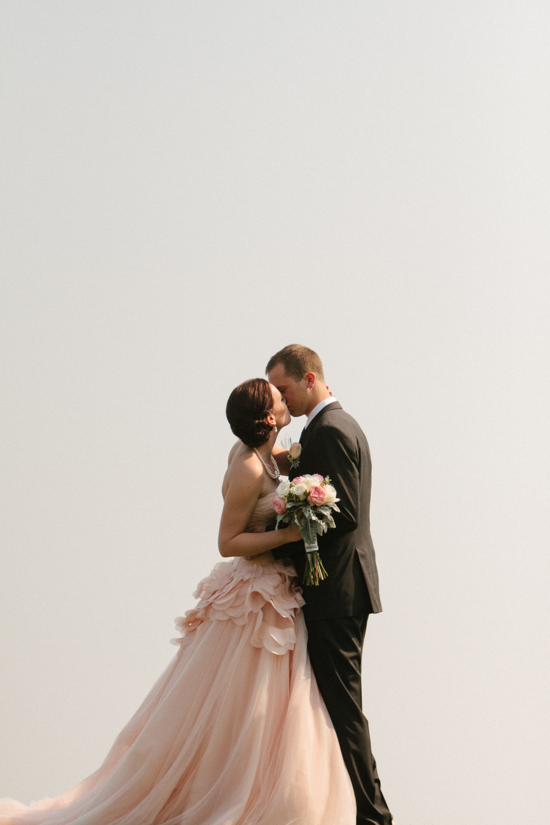  Stunning Photo of the Bride and Groom Kissing | Wedding Gown by Vera Wang | photo by blf Studios | wedding by Madeline's Weddings 