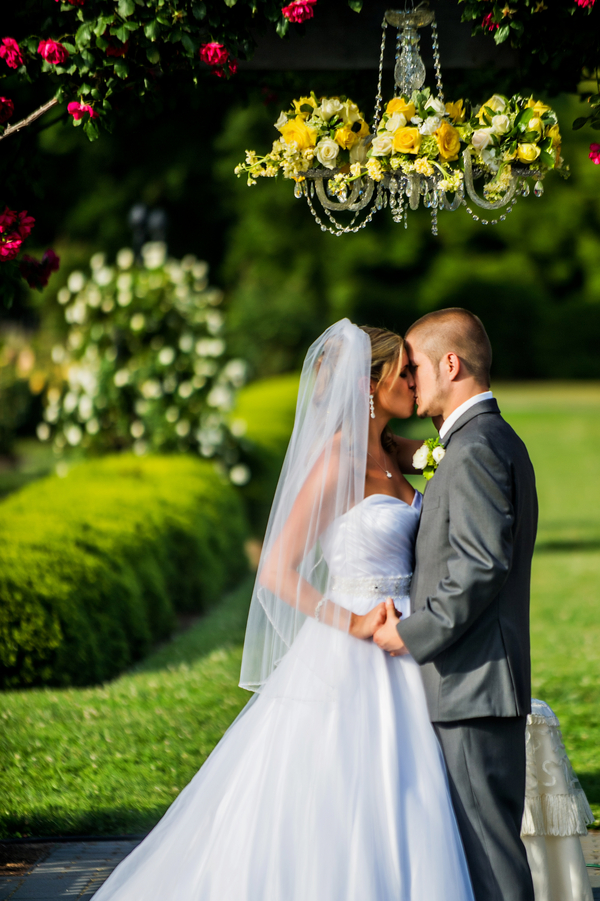  Bride &amp; Groom Married under Chandelier | photo by Ross Costanza Photography | as seen on www.BrendasWeddingBlog.com 