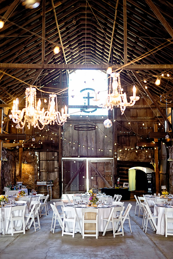  An Elegant Rustic Wedding Reception in a Barn with Chandeliers | Photo by William Innes Photography | via www.brendasweddingblog.com 