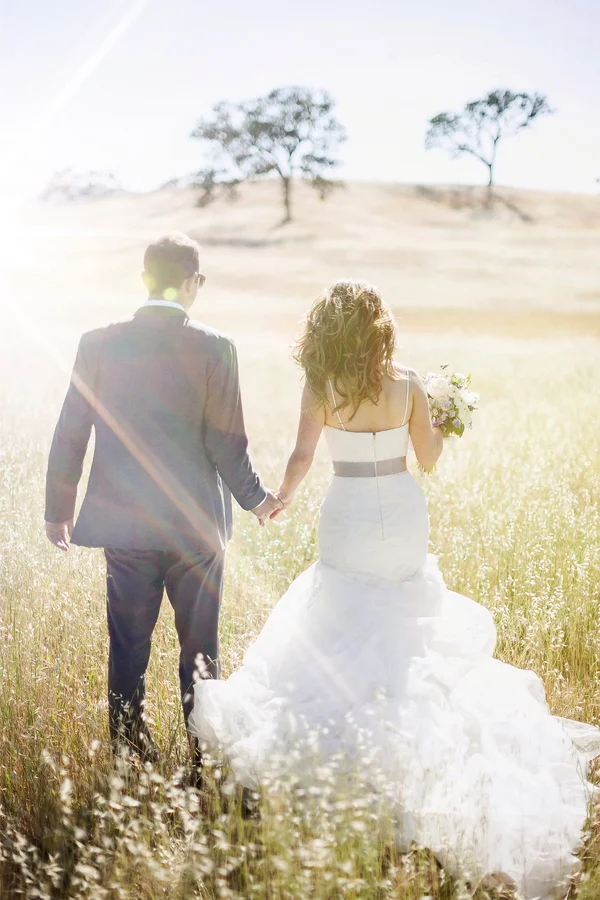 Bride and Groom Portrait in Sunny Field | Photo by William Innes Photography | via www.brendasweddingblog.com