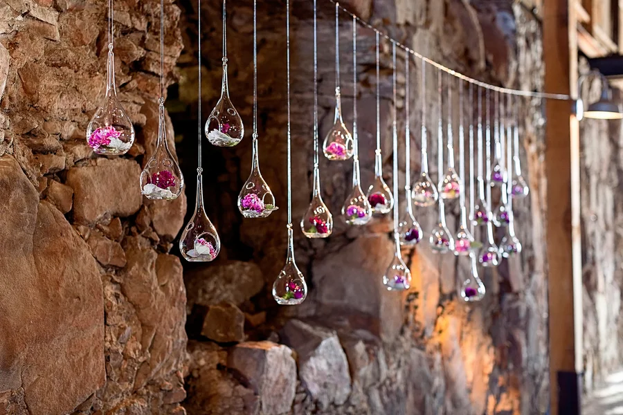 Garland of Flowers Hanging in Vases | Photo by William Innes Photography | via www.brendasweddingblog.com