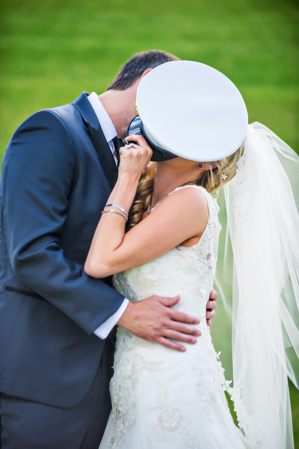  Bride Stealing a Kiss Behind the Hat | photo by Ross Costanza Photography | as seen on www.brendasweddingblog.com 