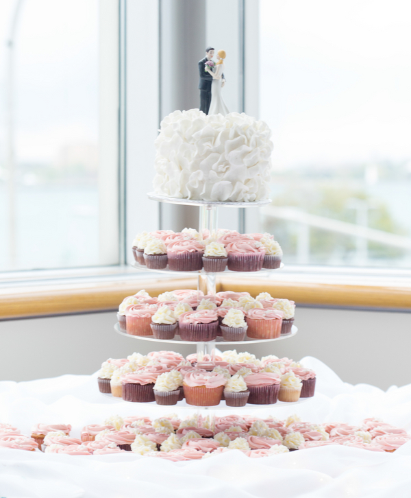  White Ruffled Wedding Cake and Pink and Ivory Cupcakes | photo by Real Image Photography | as seen on www.brendasweddingblog.com 