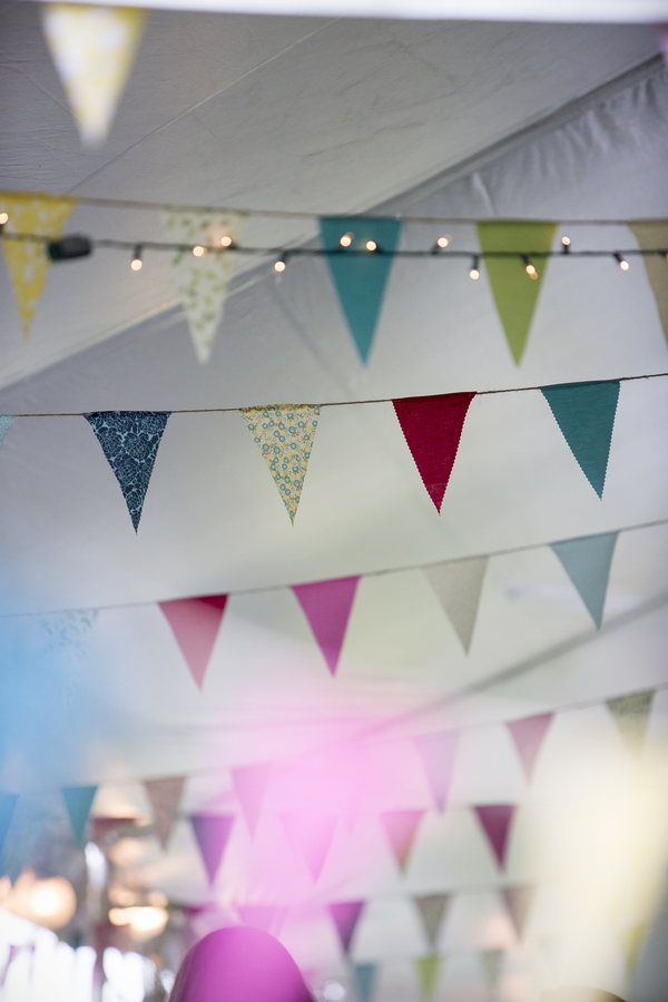  Pretty Fabric Bunting for a DIY Backyard Wedding | photo by Two Sticks Studios | as seen on www.brendasweddingblog.com 