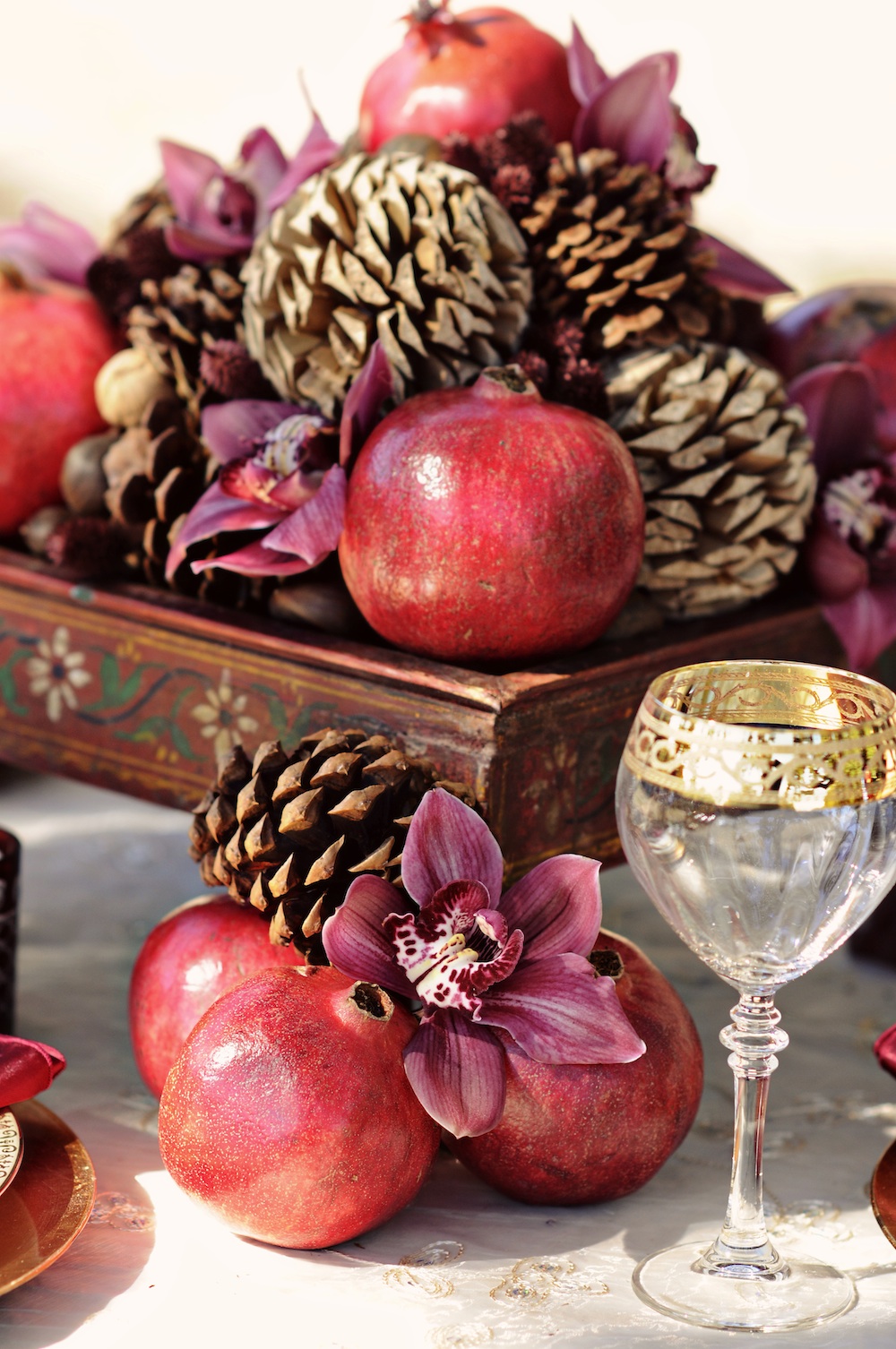  Winter Wedding Inspiration in Red and Gold : Centerpiece Details with Pomegranates and Pinecones / photo by Kismis Ink Photography / as seen on www.BrendasWeddingBlog.com 