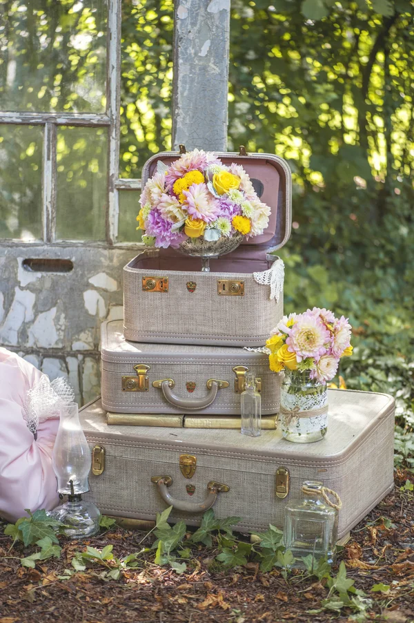 Vintage books and suitcases are the perfect prop for this Rustic Garden Inspired Wedding / styled by D'Love Affair Weddings & Events / photo by L'Estelle Photography / as seen on www.BrendasWeddingBlog.com