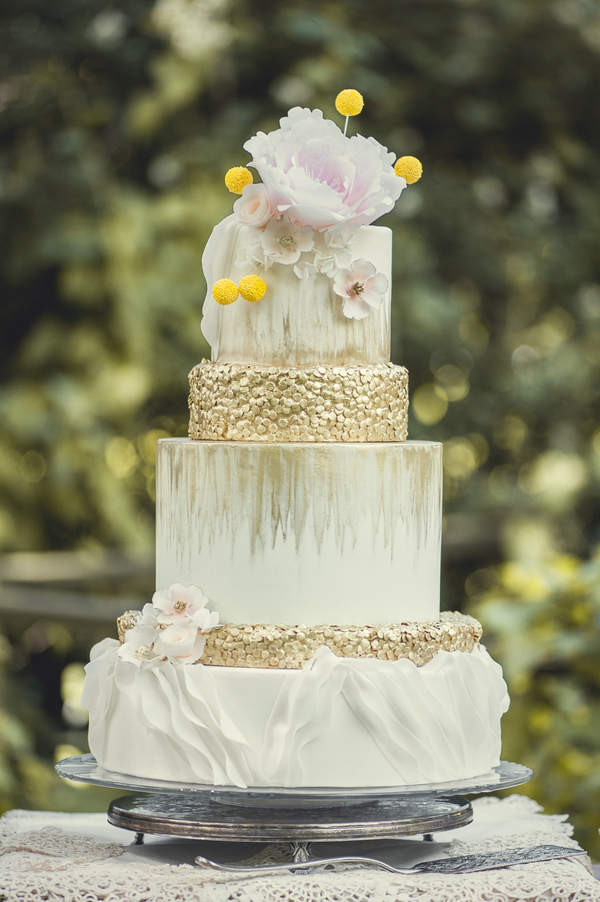  A Pink and Gold Wedding Cake that features exquisite details like ruffles and gold sequins. Painted with white and gold watercolor effects by Kitty Wong Pastry Shop / photo by L'Estelle Photography / as seen on www.BrendasWeddingBlog.com 