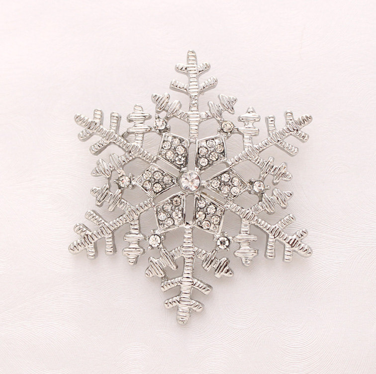 Silver Snowflake Brooch which would make a great Boutonniere for a Winter Wedding / from Crystalitzy on etsy / as seen on www.brendasweddingblog.com