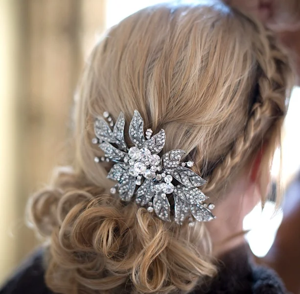 Pretty Bridal Hairstyle with a Braid and Rhinestone Clip | photo by Tracey Ann Photography / as seen on www.BrendasWeddingBlog.com