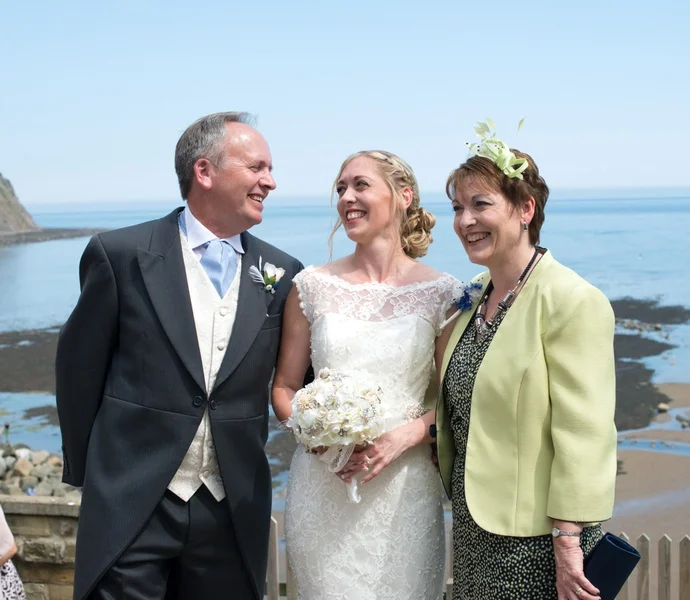 The Bride and her Parents at the Seaside Wedding in the UK | photo by Tracey Ann Photography / as seen on www.BrendasWeddingBlog.com