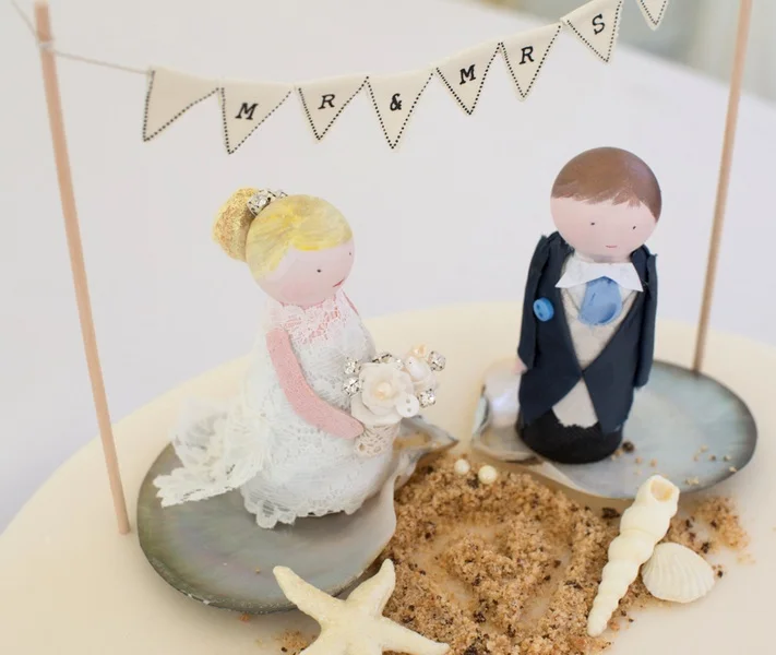 Adorable Wedding Cake Topper Peg Dolls - made by the Mother of the Bride | photo by Tracey Ann Photography / as seen on www.BrendasWeddingBlog.com