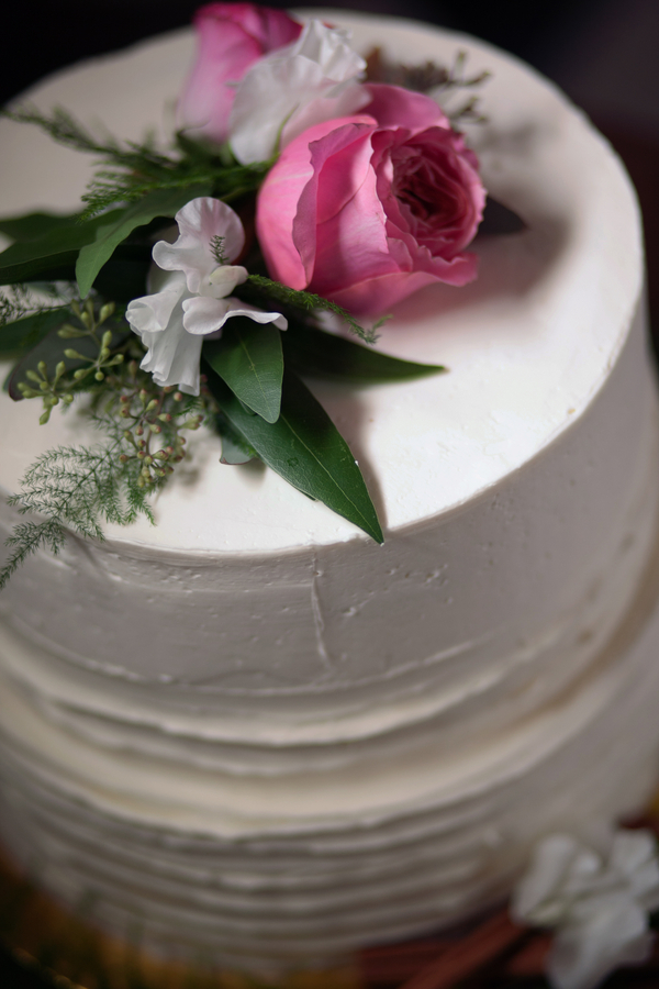  Sweet White Cake {Detail} Topped with Flowers for a Spring Wedding / cake by Amanda Bakes / photo by Corey Lynn Tucker Photography / as seen on www.BrendasWeddingBlog.com 