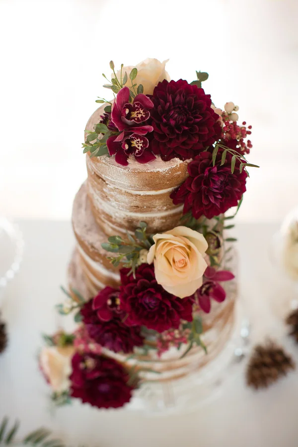 Naked Wedding Cake with Deep Red Flowers by Heavenly Delights Cupcakery / photo by Ashley Cook Photography / as seen on www.BrendasWeddingBlog.com