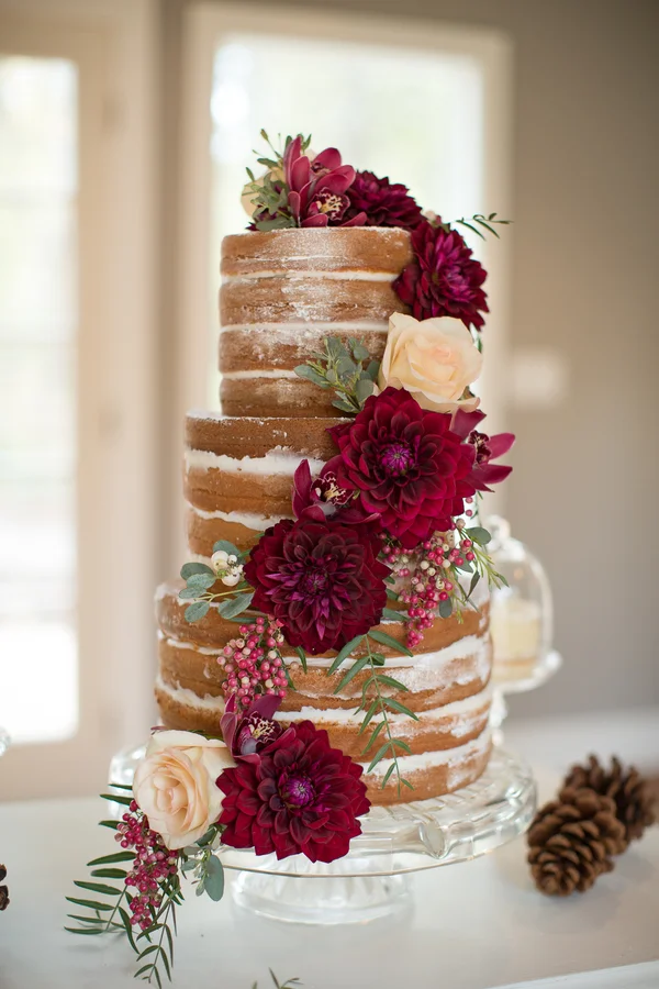 Naked Wedding Cake with Deep Red Flowers by Heavenly Delights Cupcakery / photo by Ashley Cook Photography / as seen on www.BrendasWeddingBlog.com