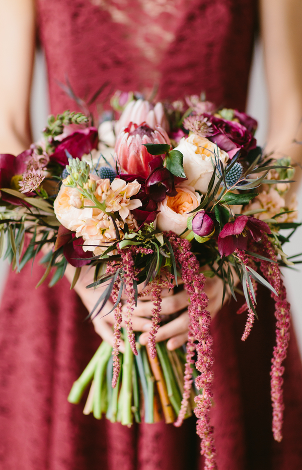  Gorgeous Wedding Bouquet with protea, ranunculus, blue thistle and lotus pods / by Wallflower Designs / photo by Maggie Fortson Photography 