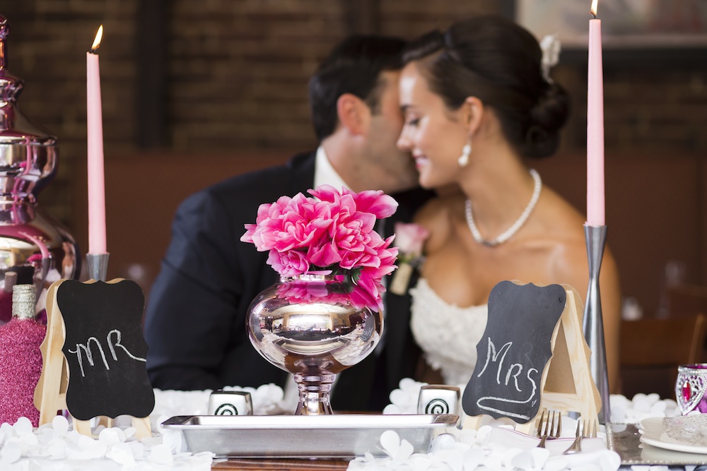  Love the Lush Bright Pink Floral Centerpiece in the Silver Vase / photo by Krista Patton Photography 