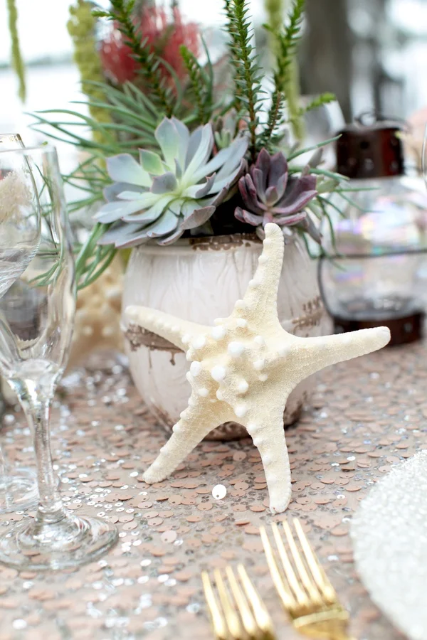 The Perfect Beach Centerpiece - succulents, starfish and sequins Pretty Under the Sea Inspired Wedding Table Display / photo by Tab McCausland Photography