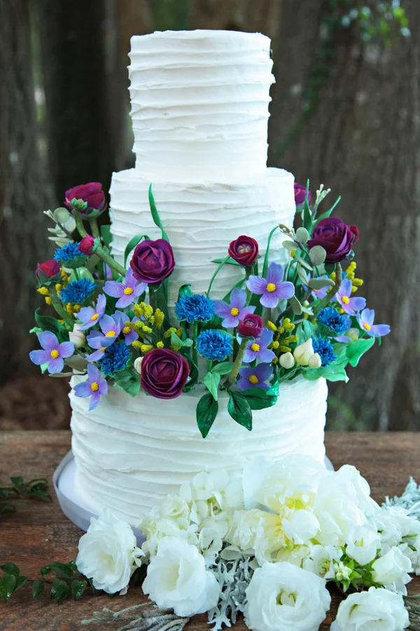 Gorgeous White Wedding Cake with Handmade Sugar Flowers by Sugar Suite / photo by Tab McCausland Photography