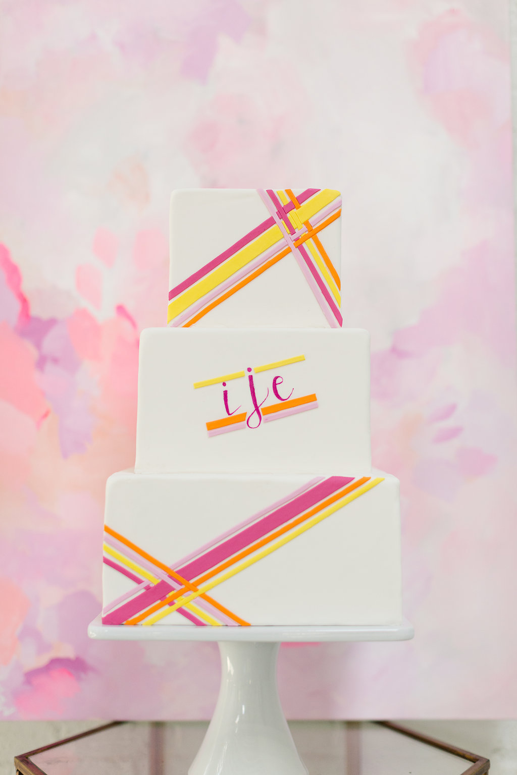 Striped Neon Wedding Cake / designed by Ashley Peraino + Ivey Weddings & Events / Cake by Erica O'Brien Cake Design / photo by Jessica Haley Photography