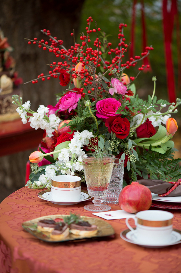 Rustic Wedding Tablesetting with Pomegranates + Berries in Bright Bold Colors / Flowers by EightTreeStreet / photo by Evelyn Alas Photography