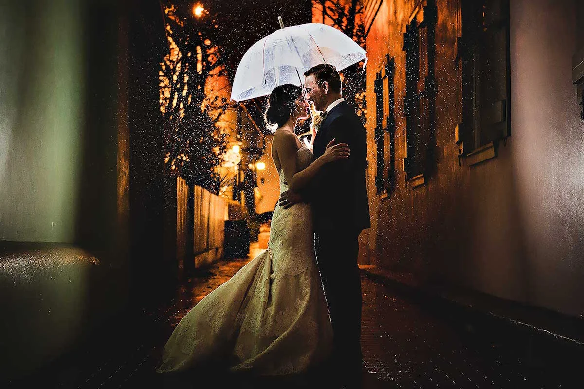 You'll wish for rain on your wedding day when your bride and groom portrait look like this / stunning nighttime wedding photograph in the rain / photo by Rae Leytham Photography / St. Augustine Florida