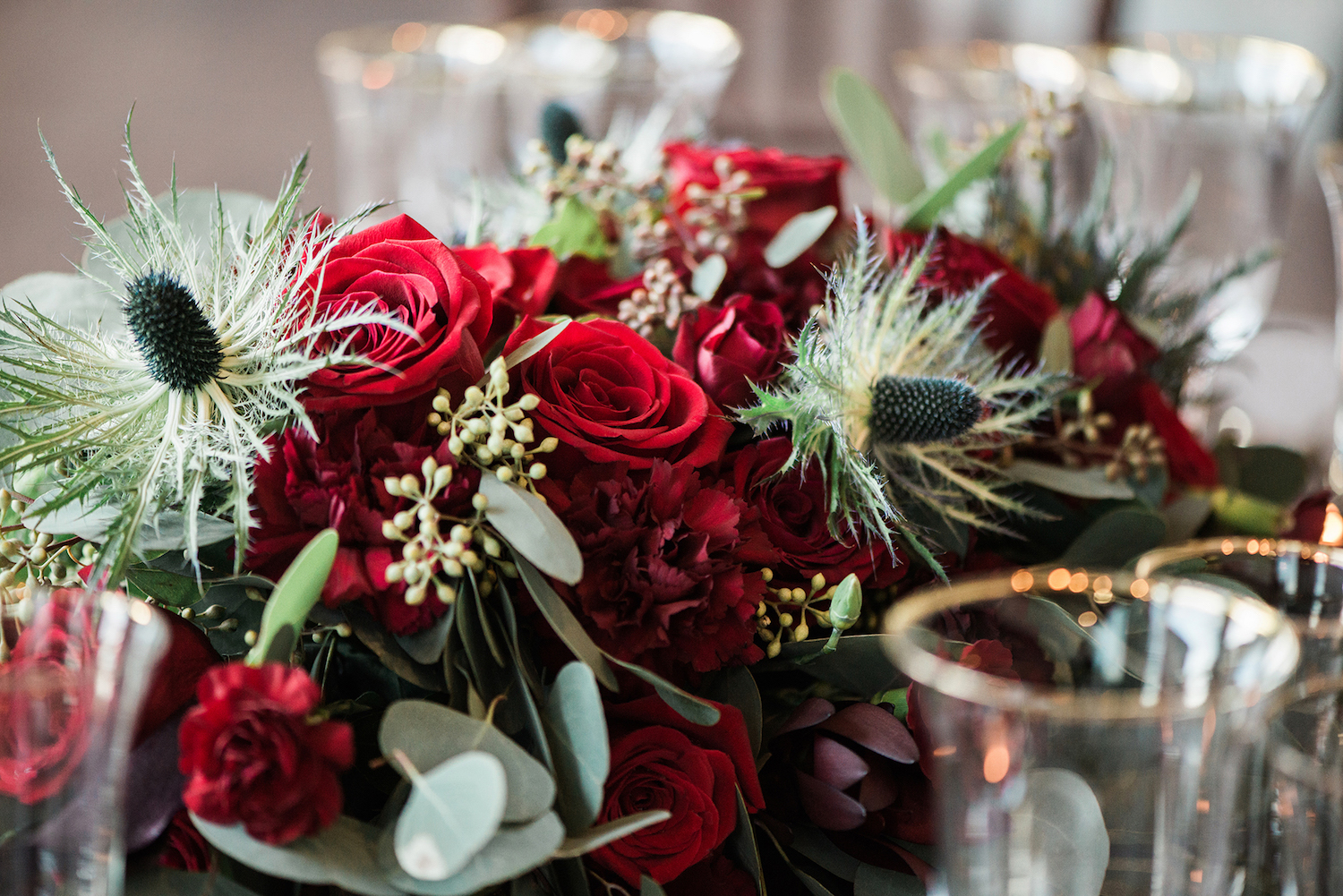Gorgeous Red Roses and Carnations with Thistle — luxurious and romantic vintage wedding inspiration — photo by Marianne Blackham Photography — as seen on www.BrendasWeddingBlog.com