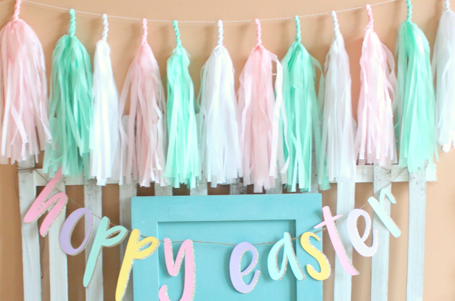 Tassel Garland in the perfect spring colors for bridal shower decor — Click to see 37 Creative DIY Wedding Ideas for Spring — as seen on www.BrendasWeddingBlog.com